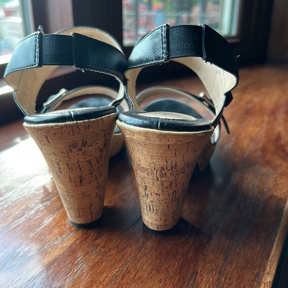 Black slip on heels with a cork sole. - Picture 3 of 3